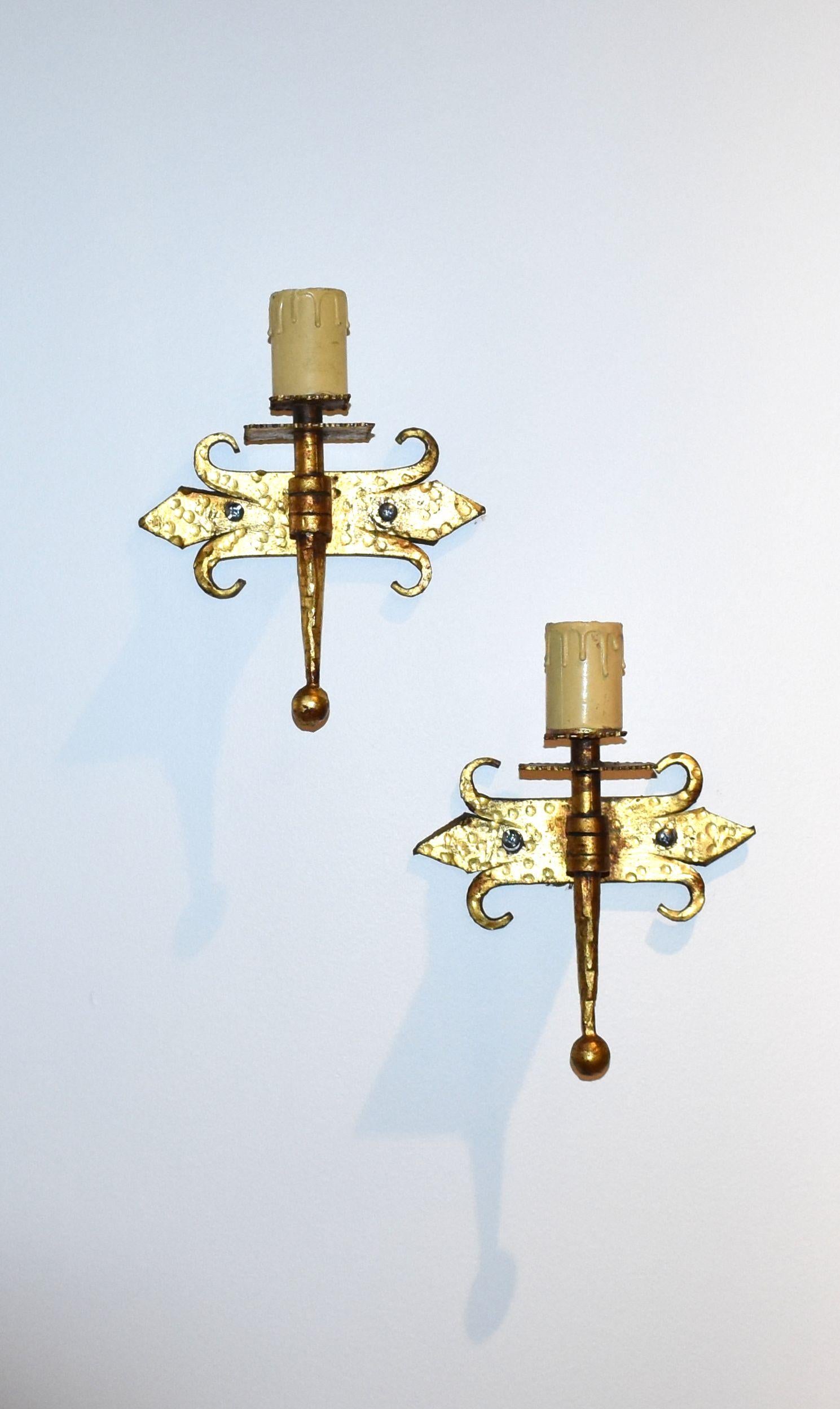1940s pair of hammered wrought iron with original gilded gold finish sconces.