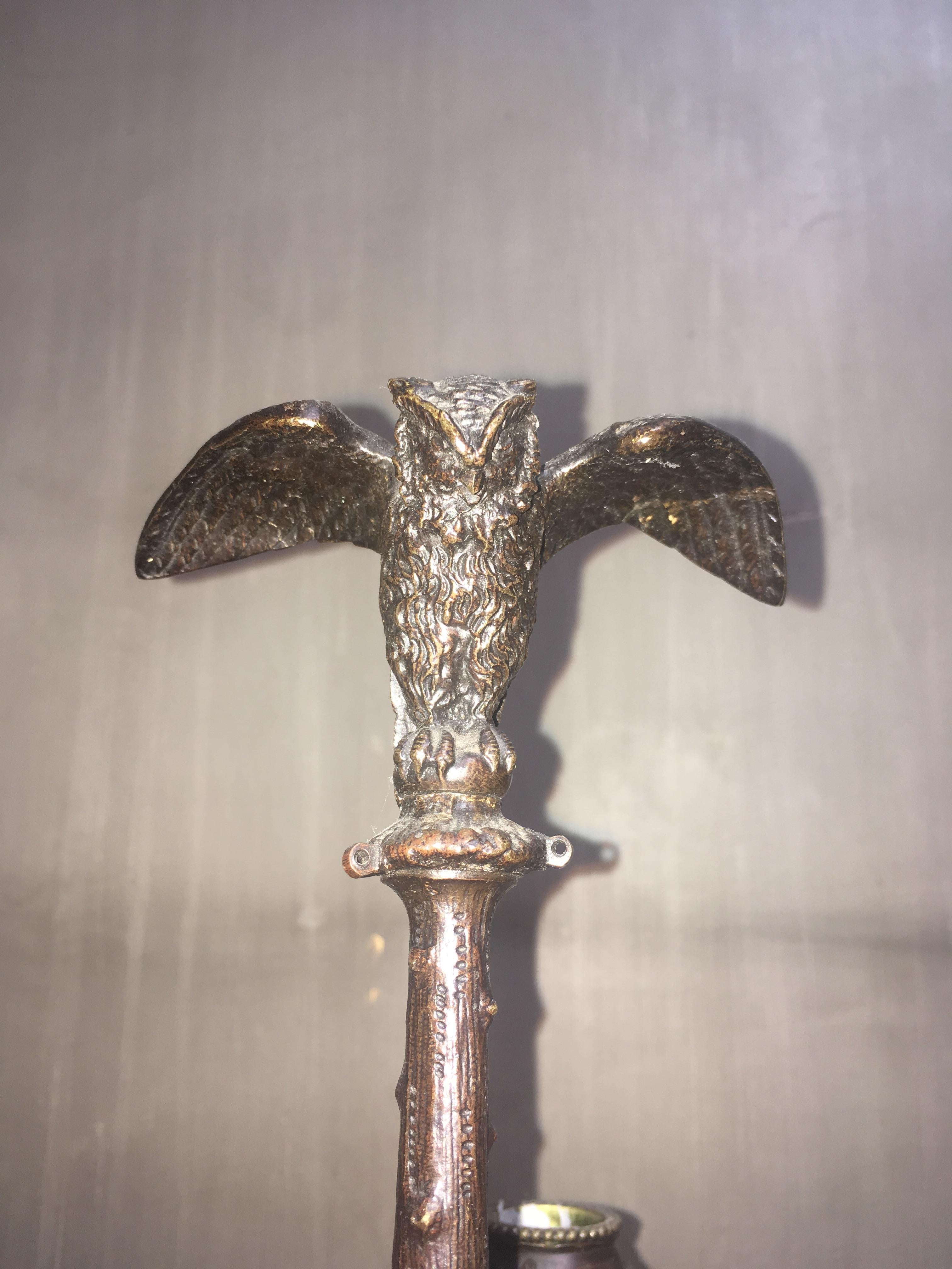 A pair of French 19th century bronze candelabra with animal motif.