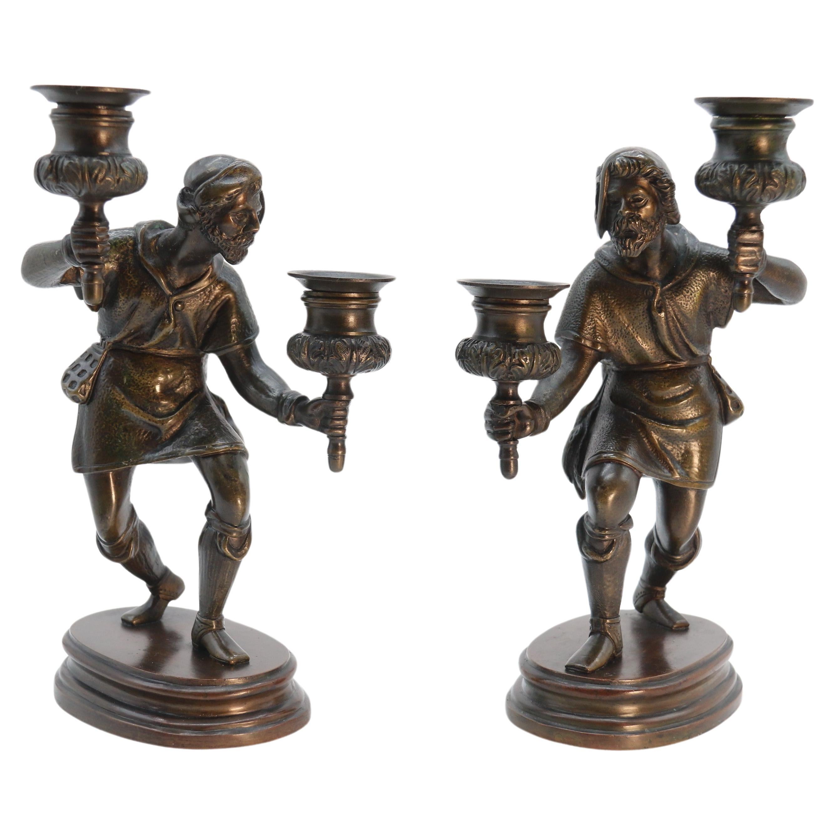 A pair of French 19th century bronze figurative double candlesticks circa 1860 For Sale