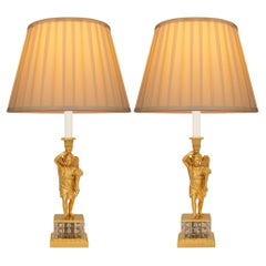 A pair of French 19th century Charles X Period Ormolu and Crystal lamps