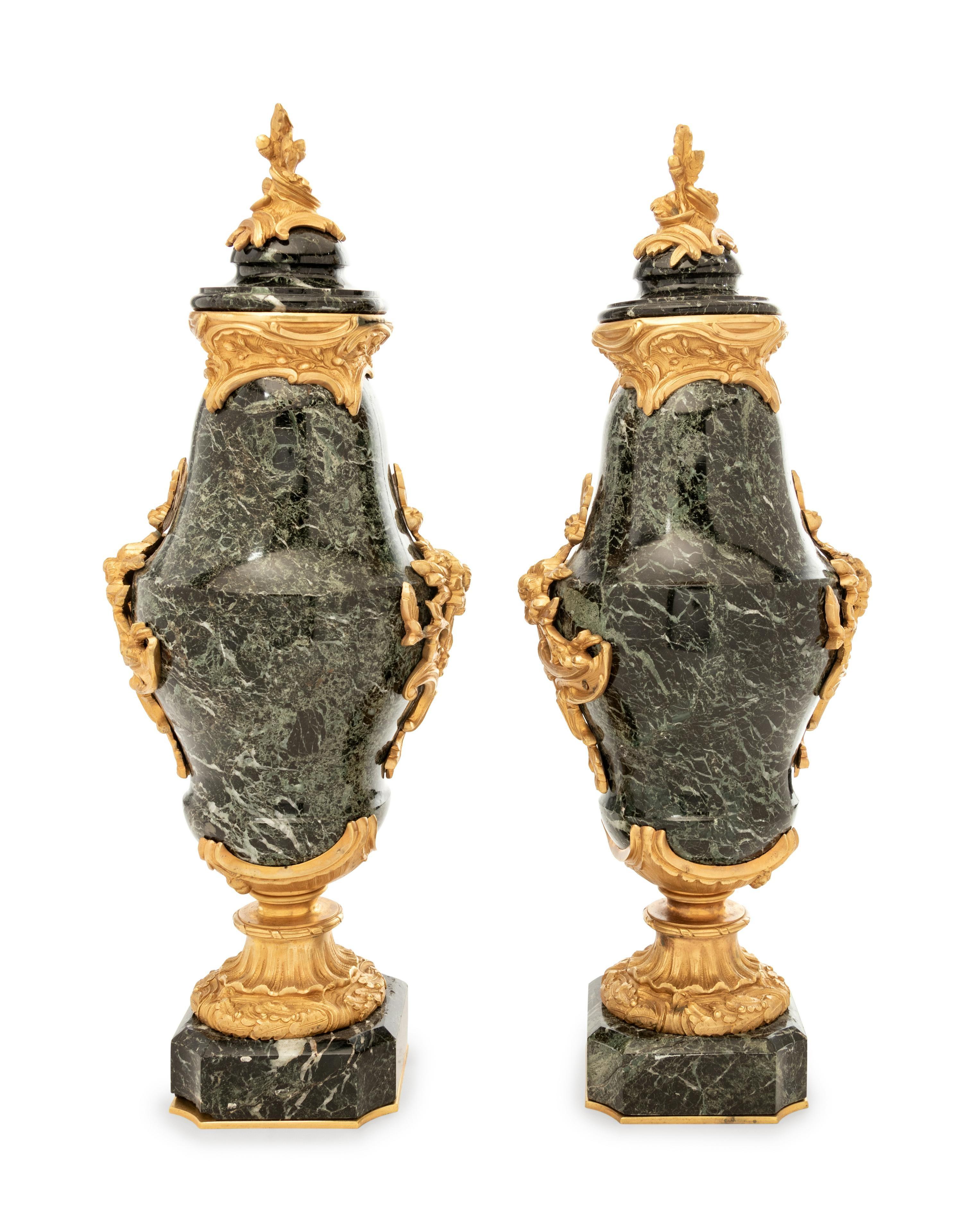 A pair of fine 19th century French green marble and gilt bronze lidded urns. Original gilt bronze with crisp detail.