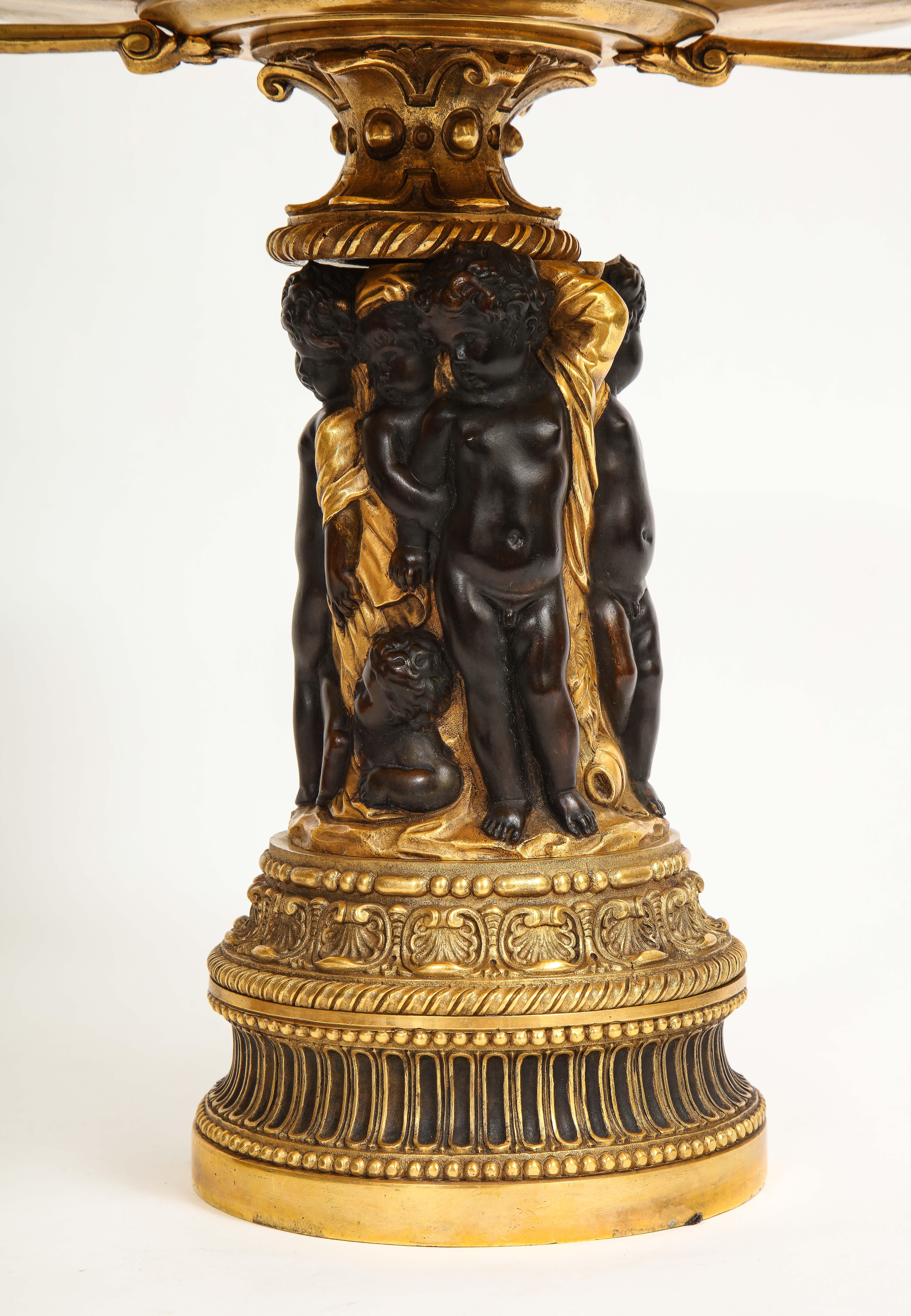 Pair of French 19th Century Dore and Patinated Bronze Handled Tazzas w/ Putti In Good Condition For Sale In New York, NY