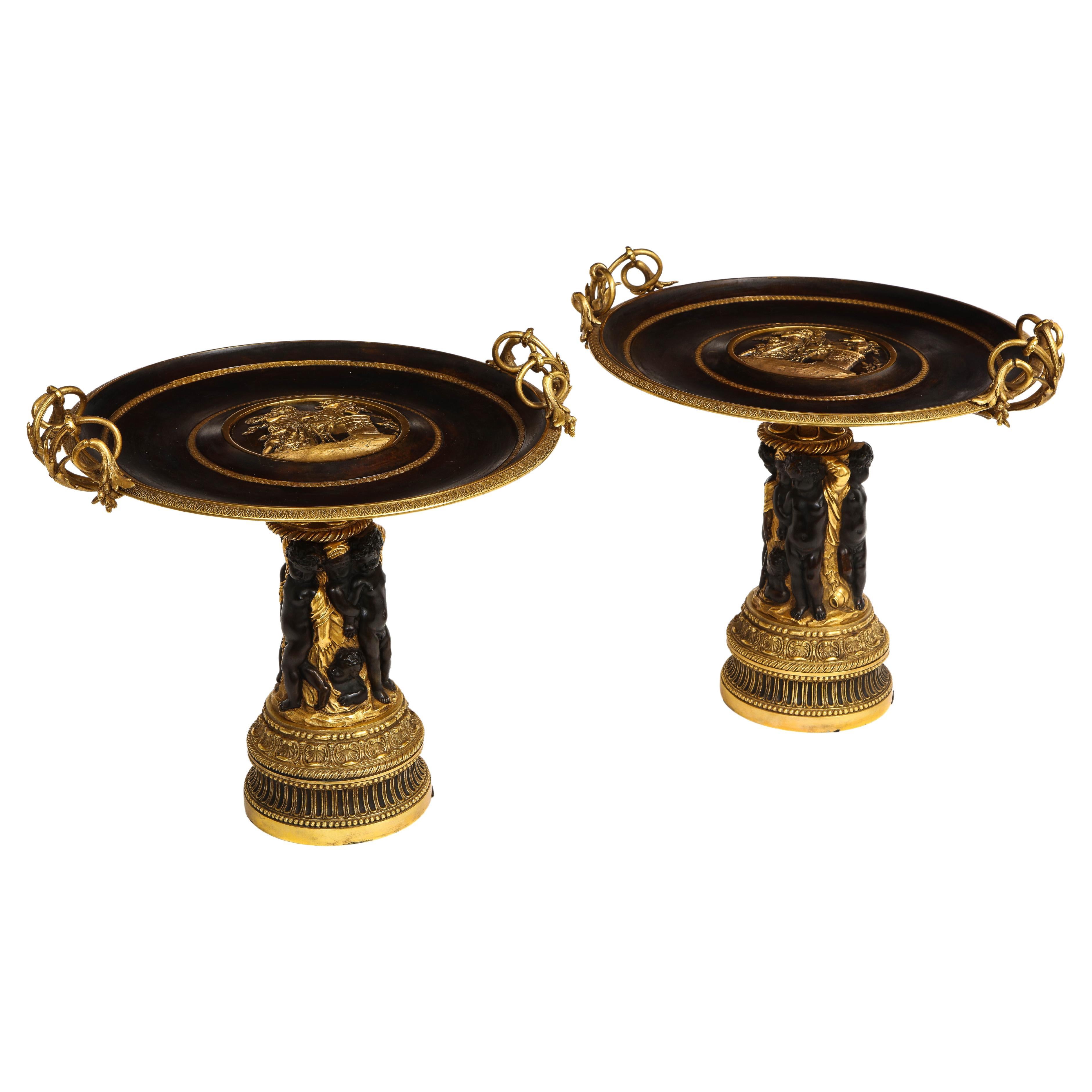 Pair of French 19th Century Dore and Patinated Bronze Handled Tazzas w/ Putti For Sale