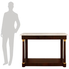 A pair of French 19th century Mahogany, Ormolu and white Carrara marble consoles