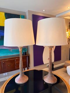 A pair of French 19th century lime oak table lamps