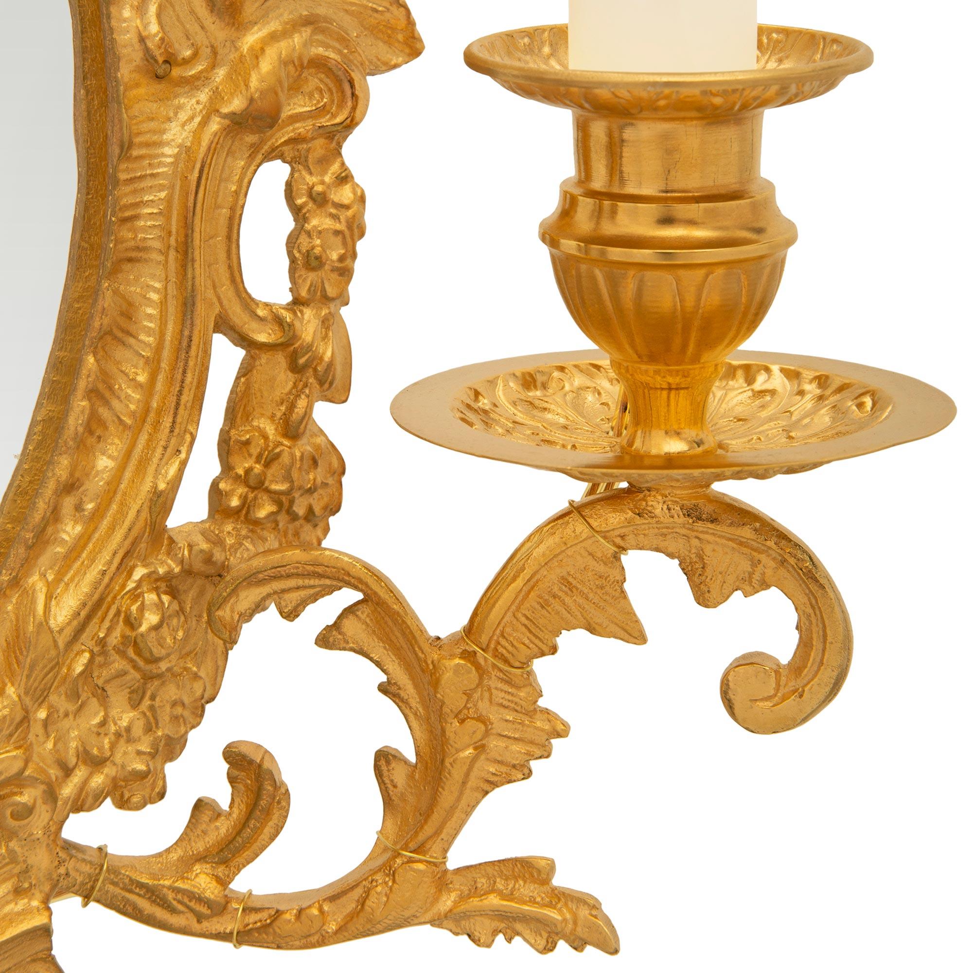 A pair of French 19th century Louis XV st. Ormolu mirrored sconces For Sale 1