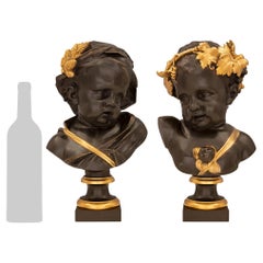 Paire de bustes de chérubins de style Louis XVI du 19ème siècle français en bronze et bronze doré