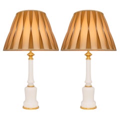 A pair of French 19th century Louis XVI st. Opaline Glass and Ormolu lamps