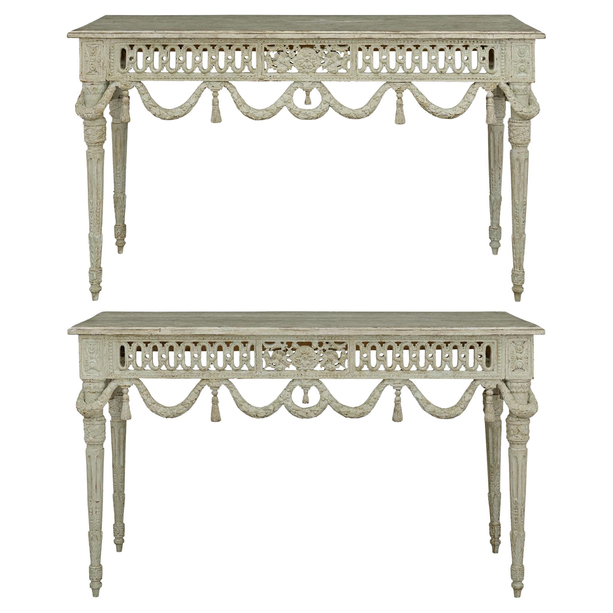 A pair of French 19th century Louis XVI st. patinated Wood consoles