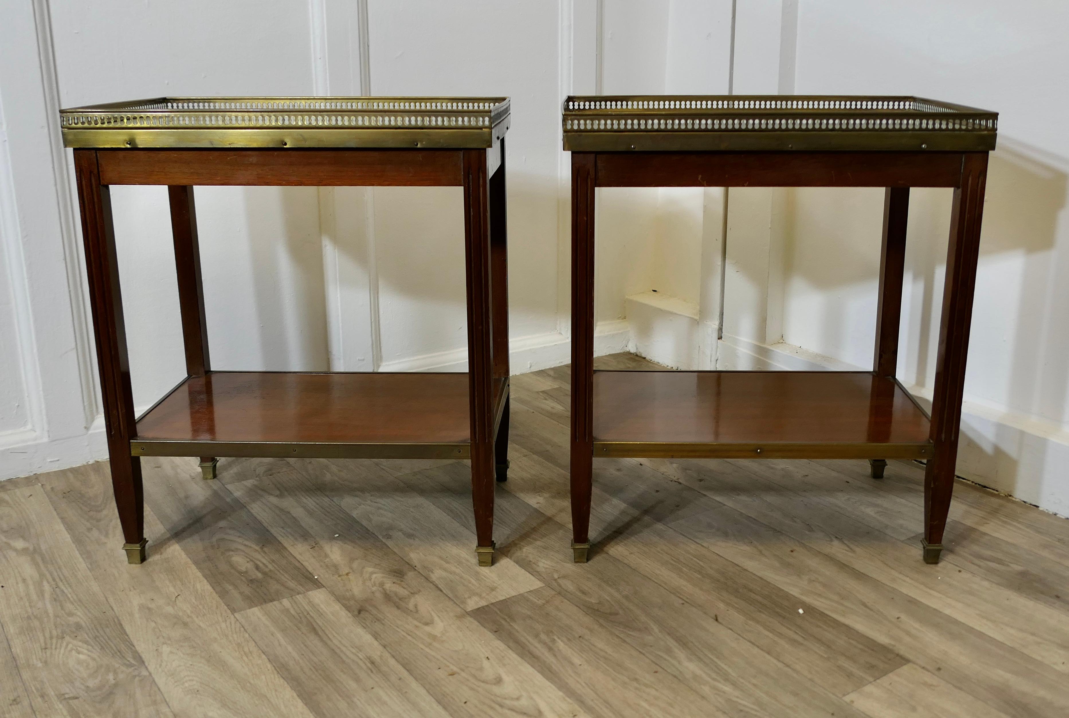A Pair of French 19th Century Occasional Lamp Tables

This is a superb quality pair of French 19th Century marble top tables, they have a pierced brass gallery around the top, and the lower tier is brass edged  
The tables are in good condition and