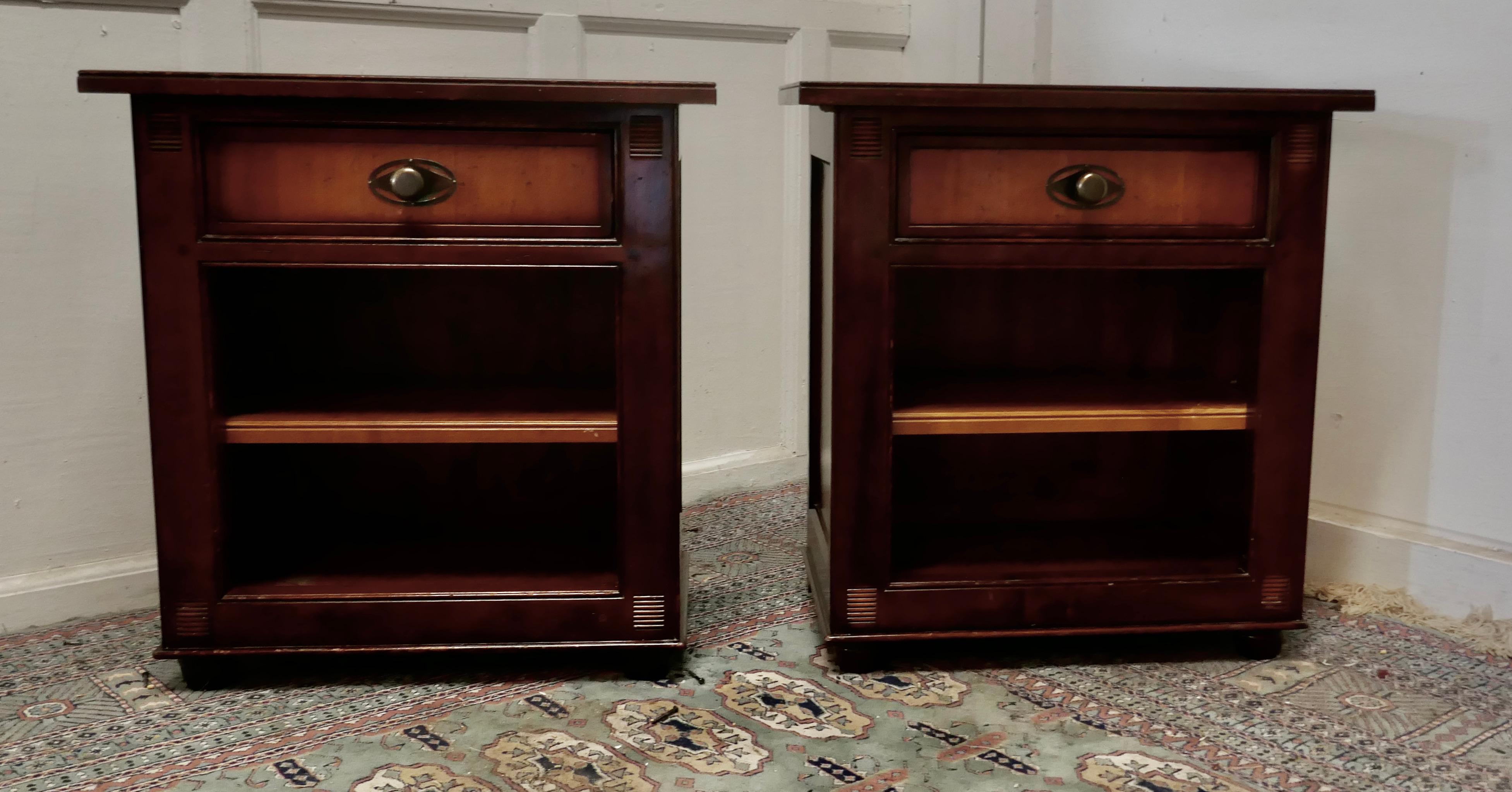 A pair of French 2 tone fruitwood bedside cupboards or night tables

 These are very attractive pieces they are made in 2 Tones of fruitwood, they each a drawer over a shelved compartment and they stand on a carved plinths 
The night tables are