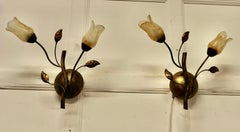 A Pair of French Art Deco Amber Glass and Toleware Gilded Wall Lights