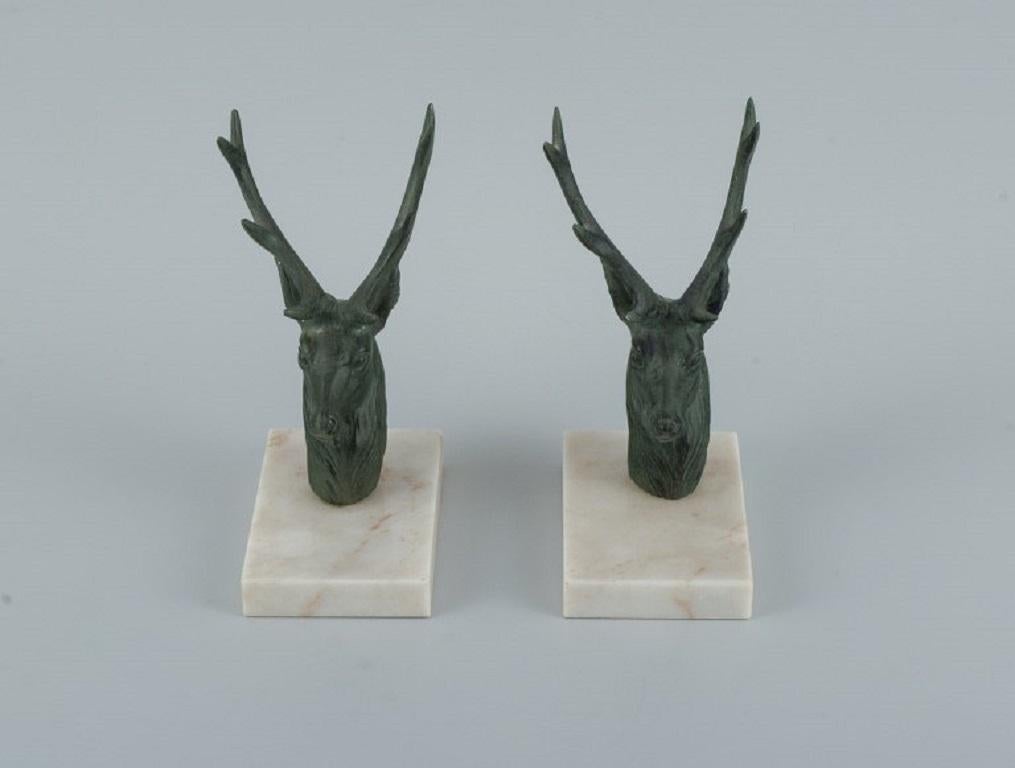 A pair of French Art Deco bookends. Stags in patinated metal on a marble base.
Approx. 1940s.
In perfect condition.
Dimensions: height 18.0 x depth 12.0 x width 8.0 cm.