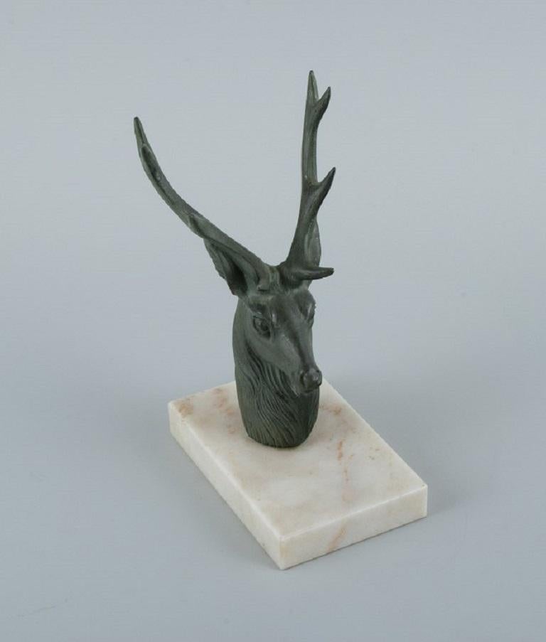 Mid-20th Century Pair of French Art Deco Bookends. Stags in Patinated Metal on a Marble Base For Sale