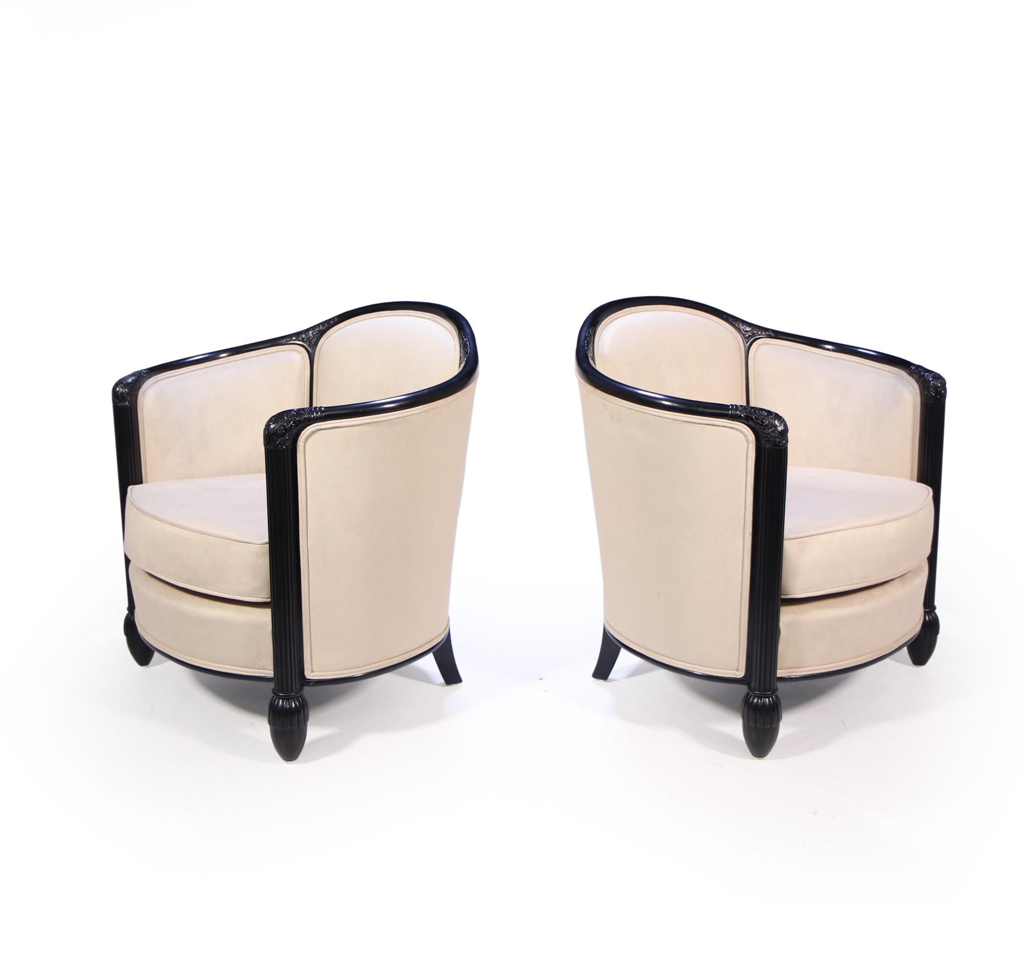 A pair of chairs and sofa in ebonised oak with reeded front leg and carved detail, great form with swooping arm rest, the suite has been fully stripped down fully polished and upholstered in soft cream suede type fabric that is stain resistant and