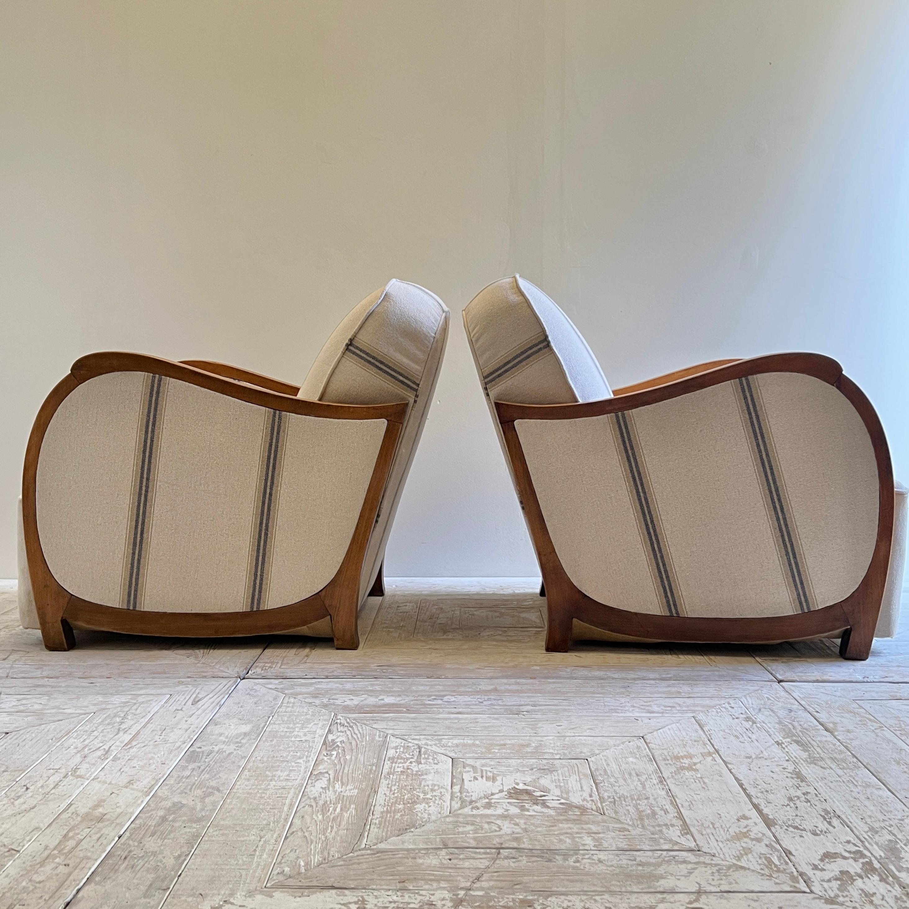 A Beautiful Pair of Parisian Art Deco Linen-Upholstered Armchairs

Sympathetically cleaned, refreshed, and polished, these chairs have been professionally reupholstered in a high-quality, thick striped linen fabric.

They feature elegant, flowing