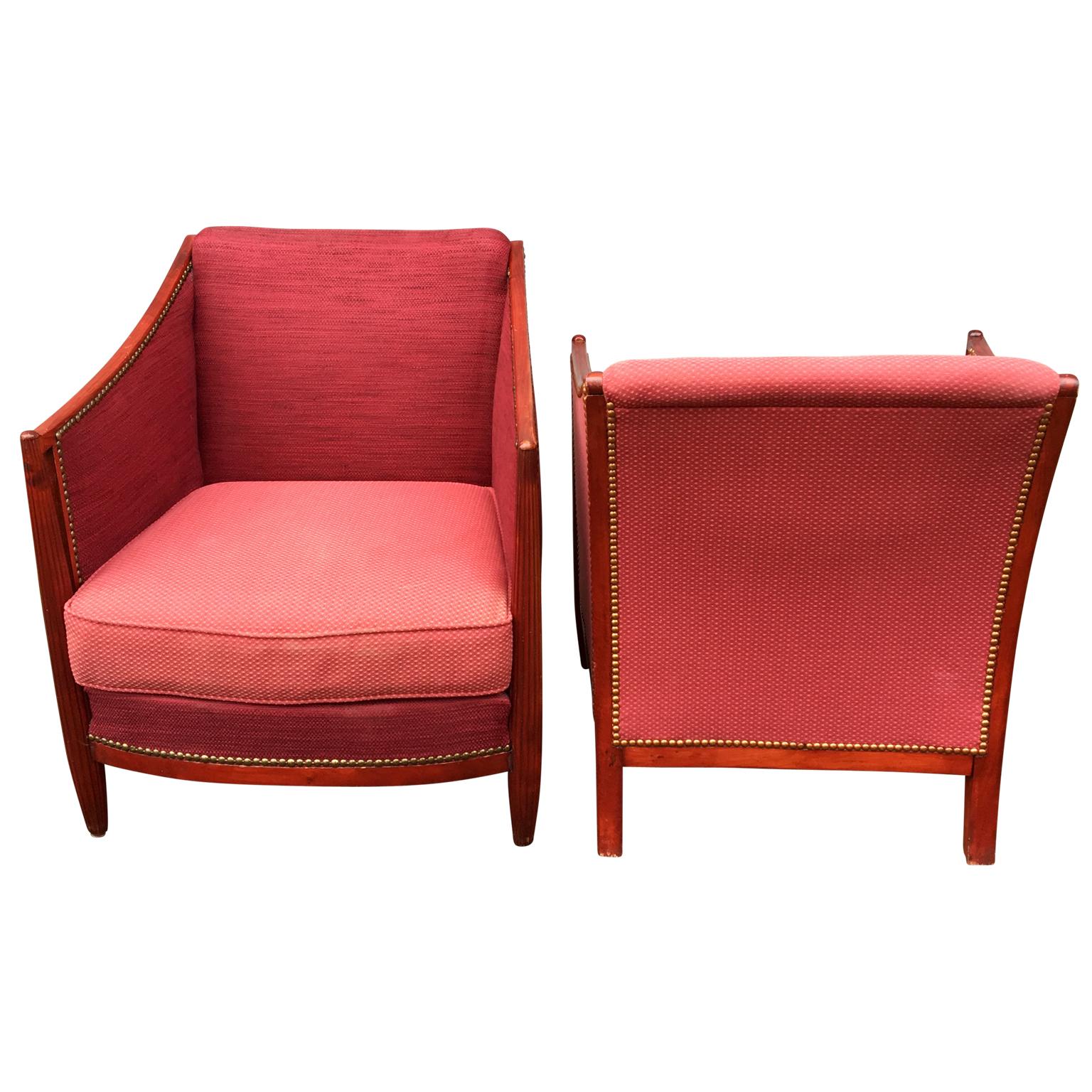 A pair of French Art Deco lounge chairs in mahogany wood, from a hotel in Strassbourg France.