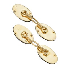 A pair of French Art Deco onyx and diamond cufflinks