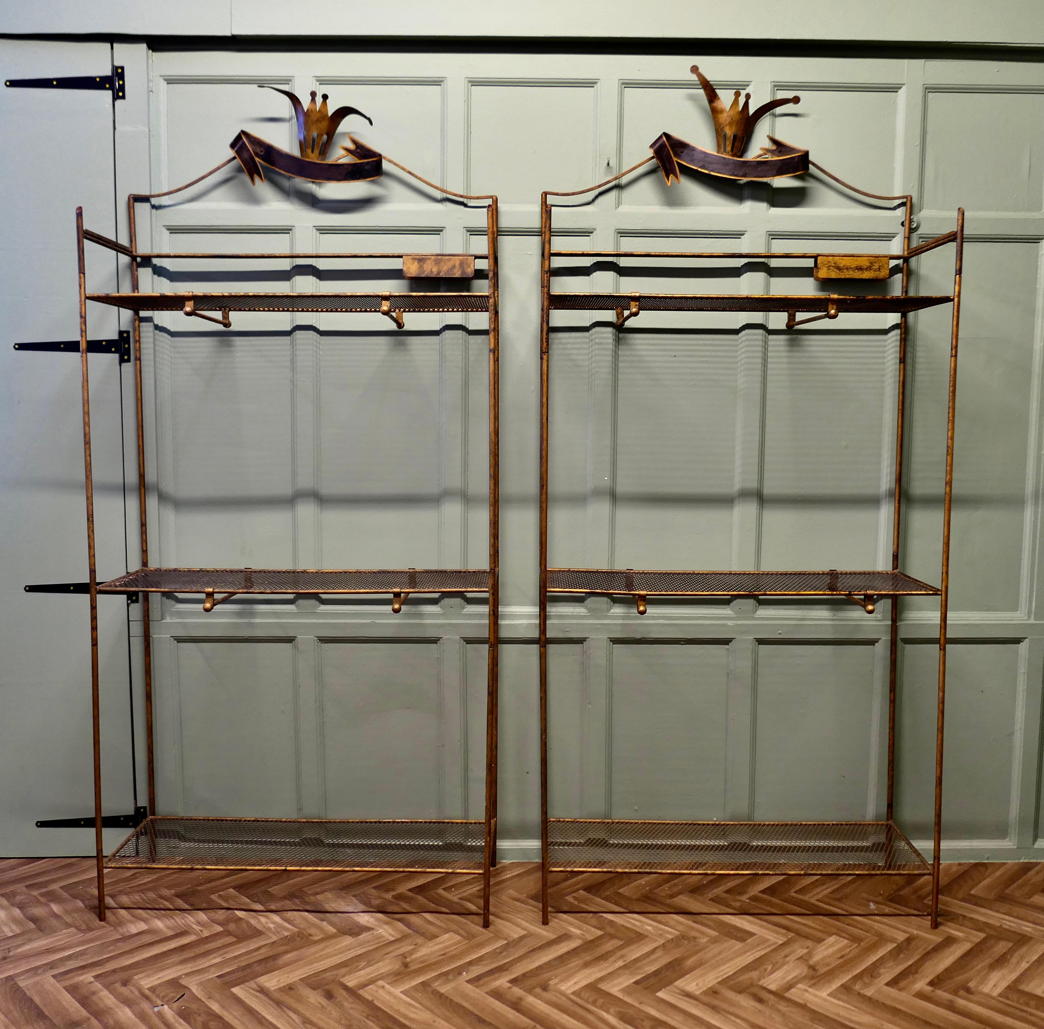 A Pair of French Art Deco Outfitter’s Shop Display Shelf Units

These are 2 very impressive freestanding units the tall racks each have 3 wire mesh shelves, the 2 higher shelves each support 2 hanging rails underneath and both racks have a striking