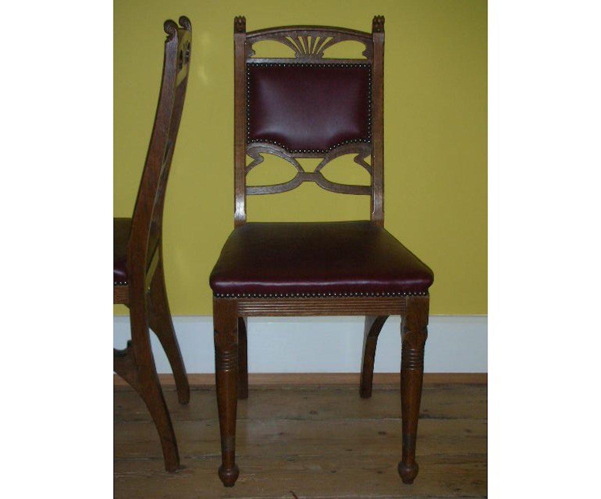 A pair of French Art Nouveau oak dining chairs with organic back design turned front legs and whiplash side stretchers in the true Nancy style.
Professionally reupholstered in quality leather.