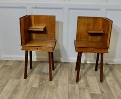 A Pair of French Arts and Crafts Outré Bedside Tables