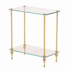 A pair of French brass and glass tiered end tables, C. 1950.