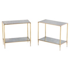 A pair of French brass and mirror end tables in the manner of Jansen C 1950