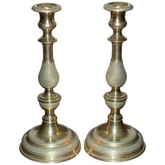 A pair of French Brass Candlesticks
