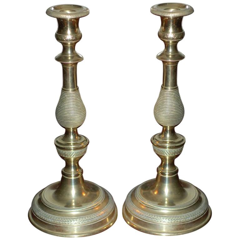 A pair of French Brass Candlesticks For Sale