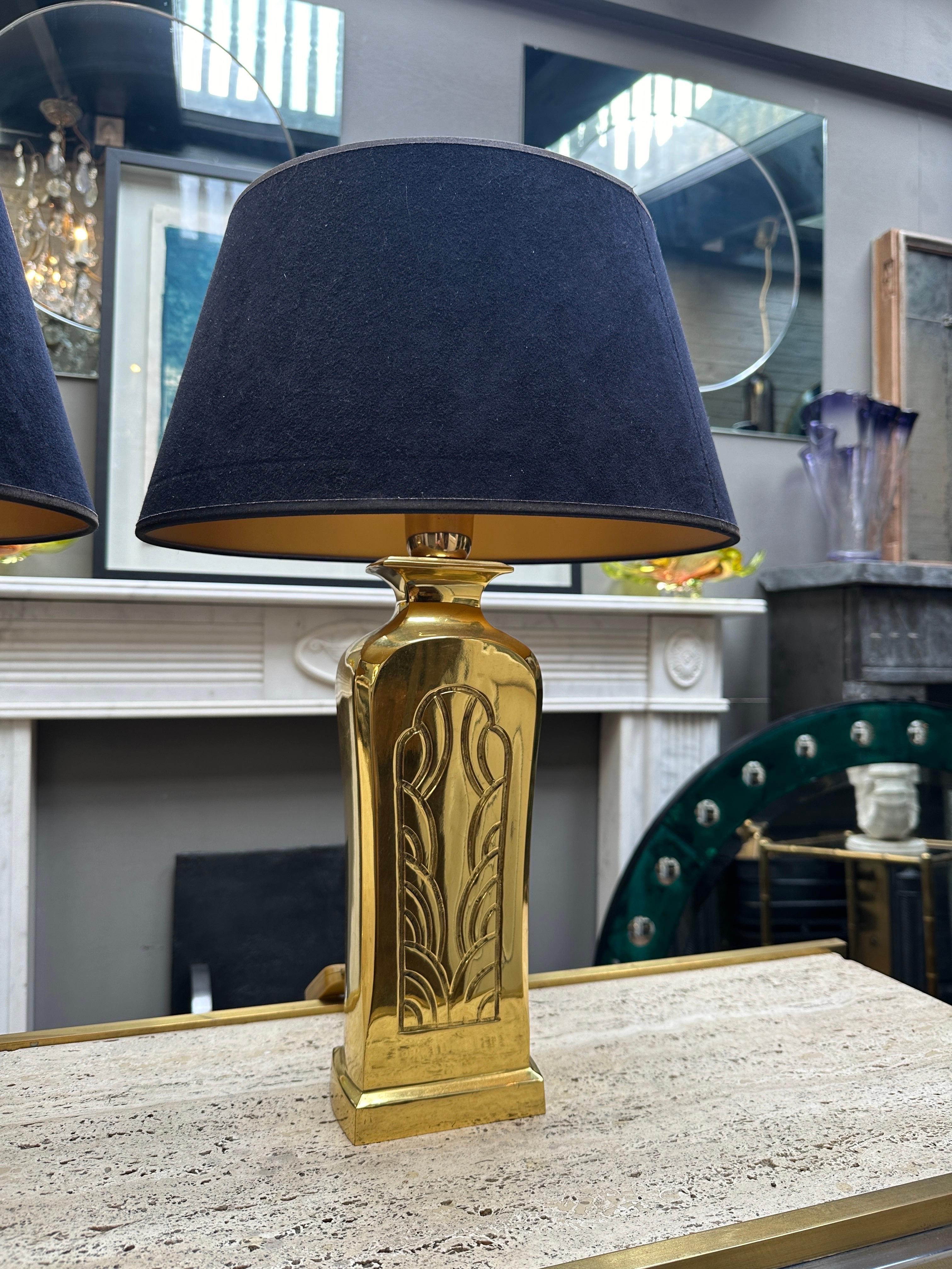 A pair of French polished cast brass table lamps with decorative pattern to facia, brushed cotton black shades with gold liner. Perfect for bedside lighting or smaller side or end tables. original shades and good quality lamps 