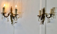 A pair of French Brass Twin Wall Lights   The lights are in the classical style