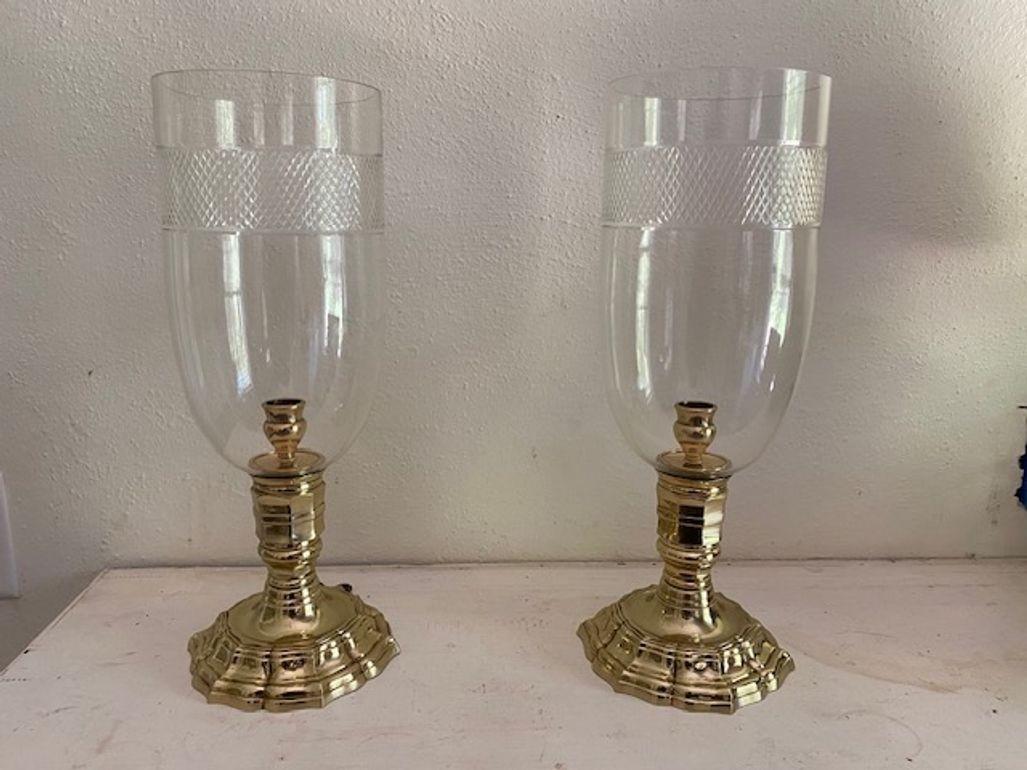 19TH/20TH CENTURY, lacquered bronze. Each in the Regence style with faceted stem and shaped base

17 in. height
6 in. diameter