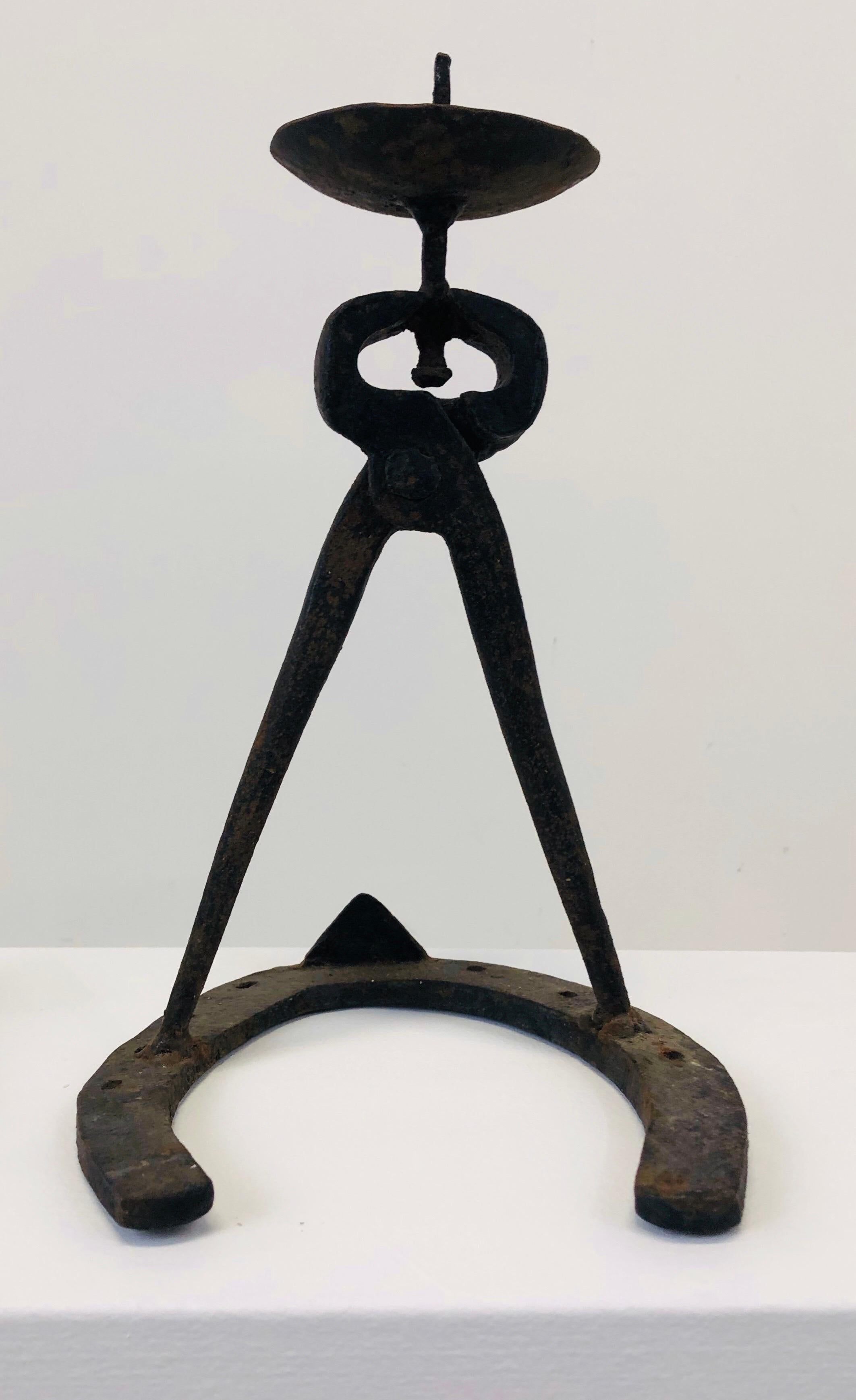 A unique set of two brutalist candle holders from the fifties.

each one is made and welded from a pincer, a horseshoe and a nail.

Great design and great patina.

 