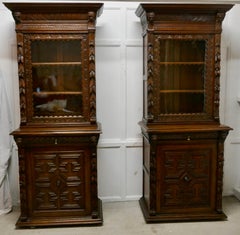 A Pair of French Carved Gothic Oak Bookcases