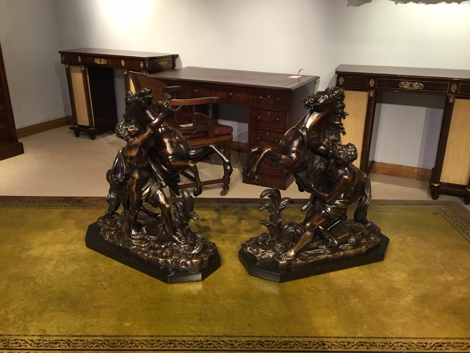 A pair of French Classical 19th century bronze Marley horses after Coustou depicting rearing horses being restrained by a groom. These are 19th Century copies after the antique, circa 1880.

Dimensions: 12