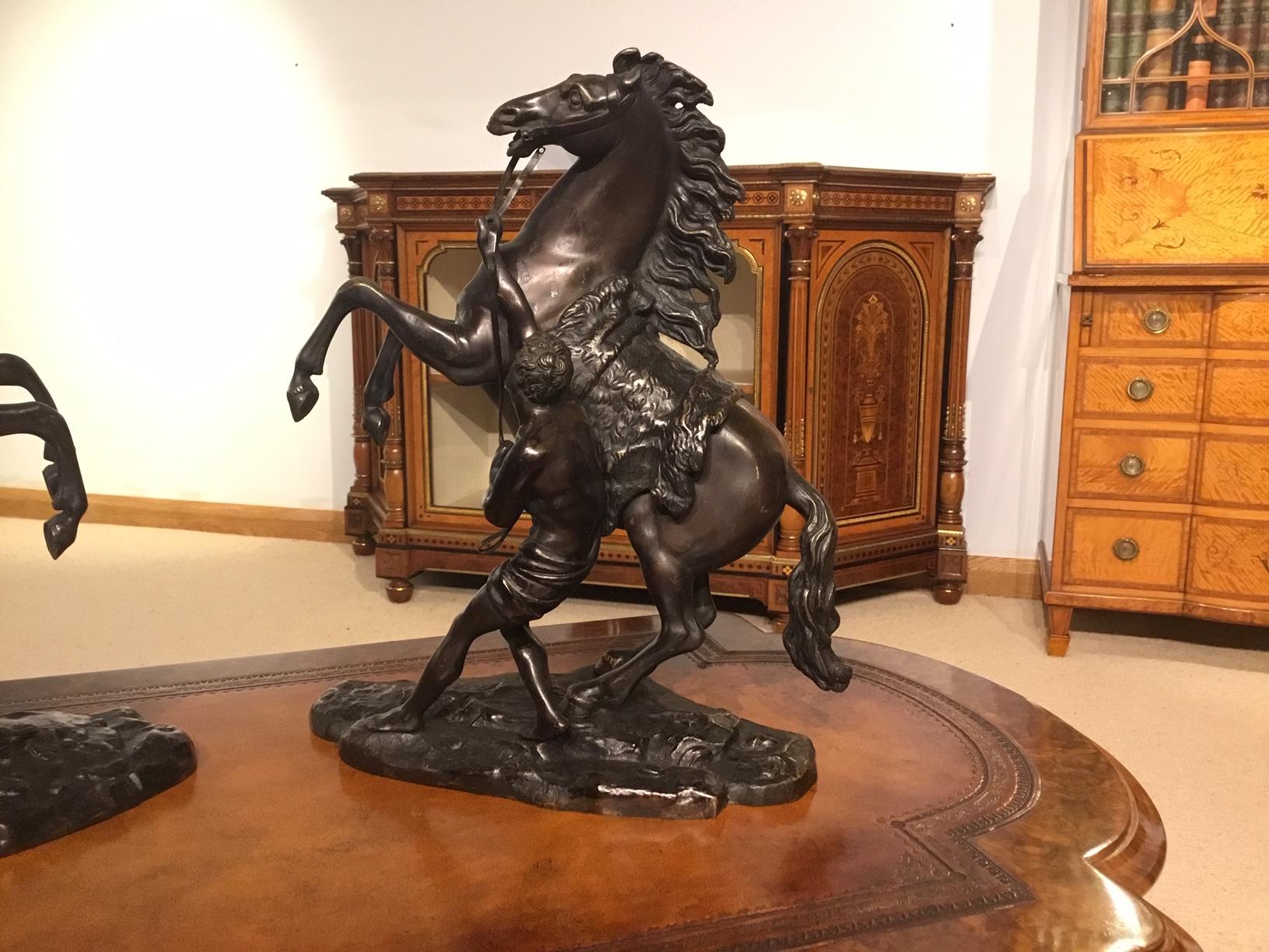A pair of French Classical 19th century bronze Marley horses after Coustou depicting rearing horses being restrained by a groom. These are 19th Century copies after the antique circa 1880

Dimensions: 15