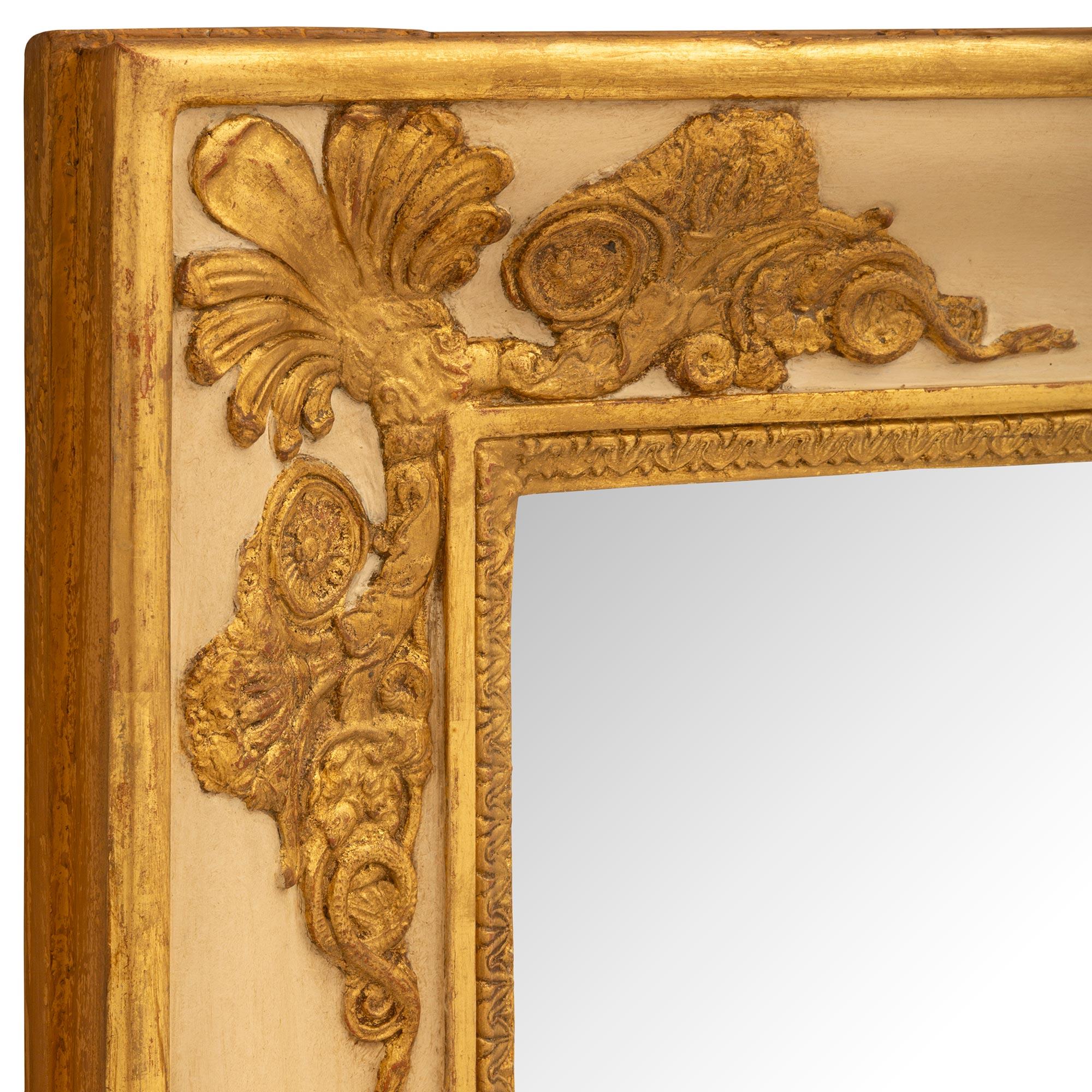 Giltwood A pair of French early 19th century Empire period giltwood mirrors For Sale