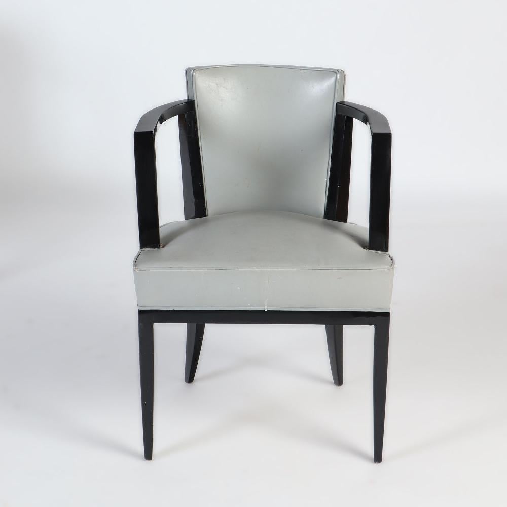 Ebonized A Pair of French ebonized open armchairs with faux leather upholstery. C 1940 For Sale
