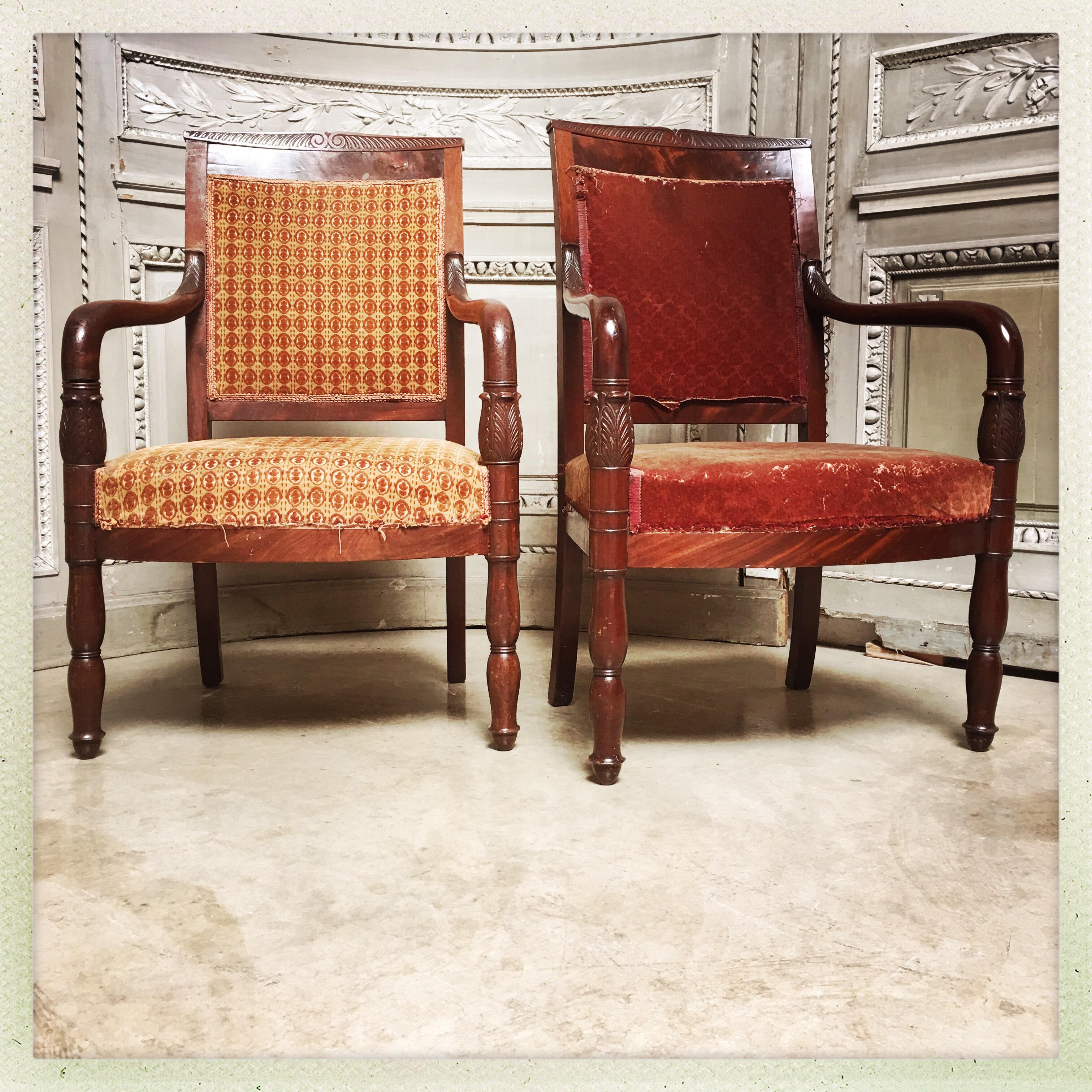 A pair of French Empire mahogany armchairs.