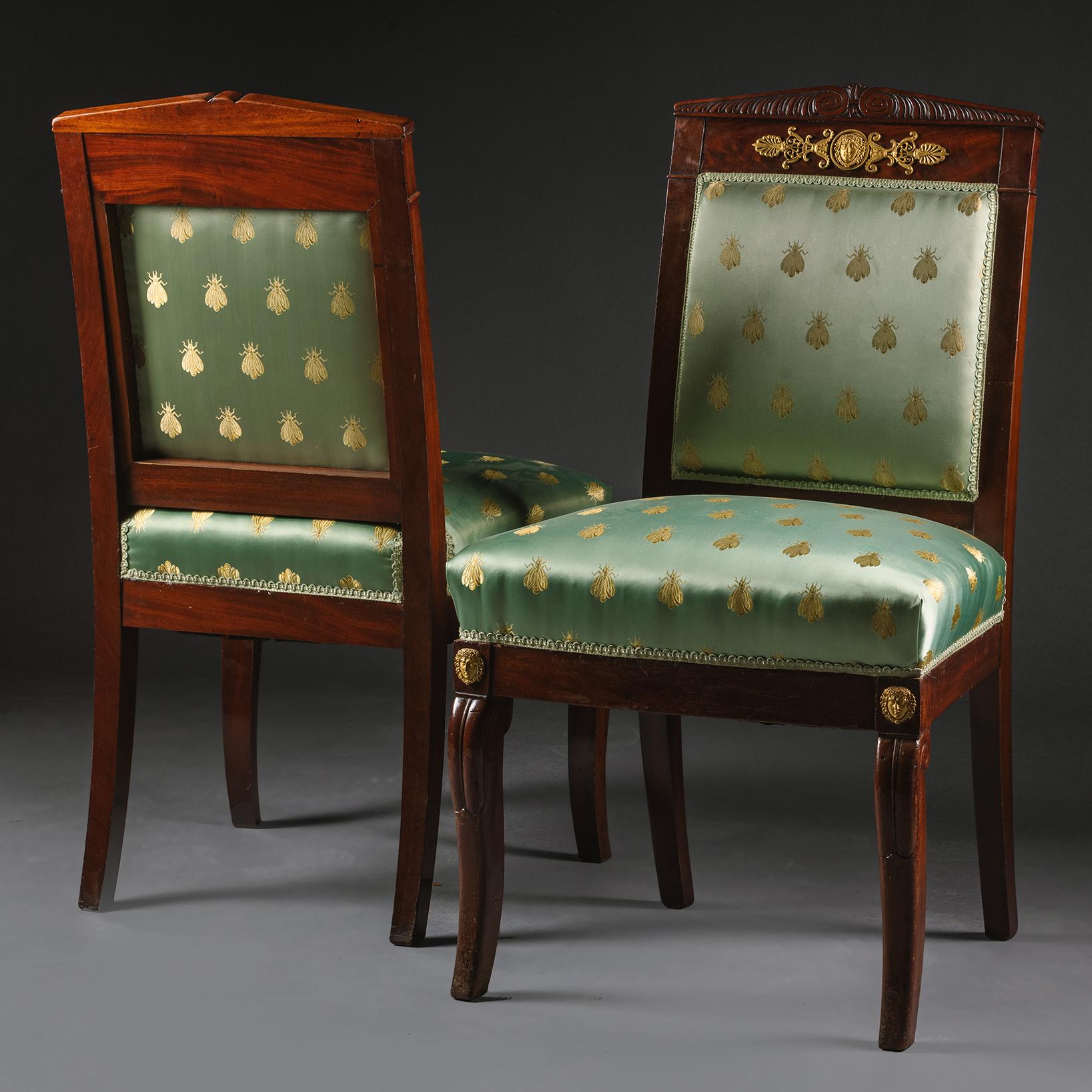 A pair of Empire Period gilt-bronze mounted side chairs.
 
French, Circa 1820.