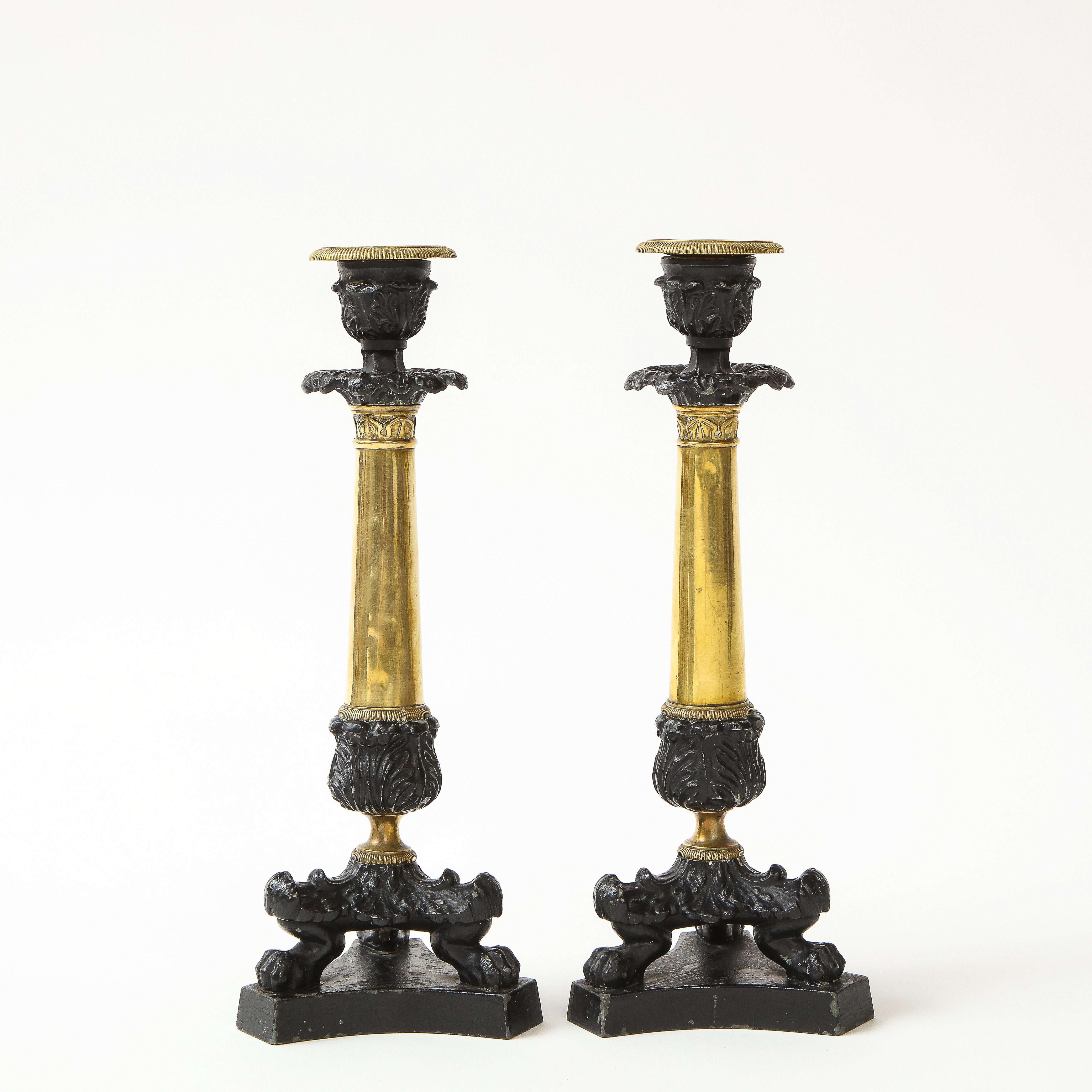 Pair of French Empire Polished Brass and Black-Enameled Cast Iron Candlesticks In Good Condition For Sale In New York, NY