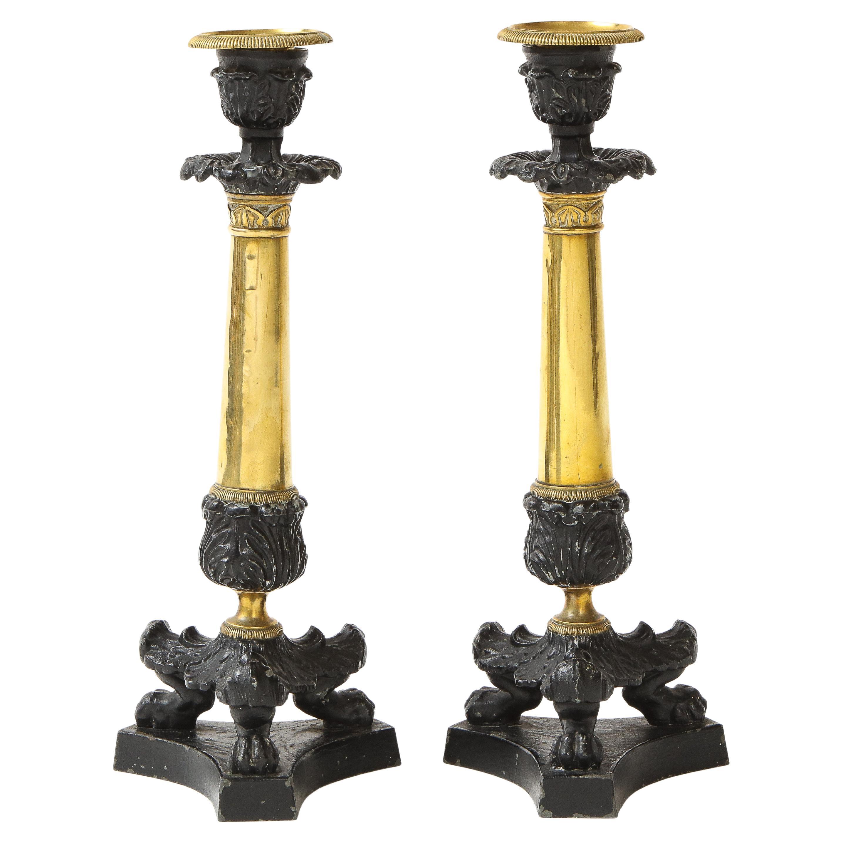 Pair of French Empire Polished Brass and Black-Enameled Cast Iron Candlesticks For Sale