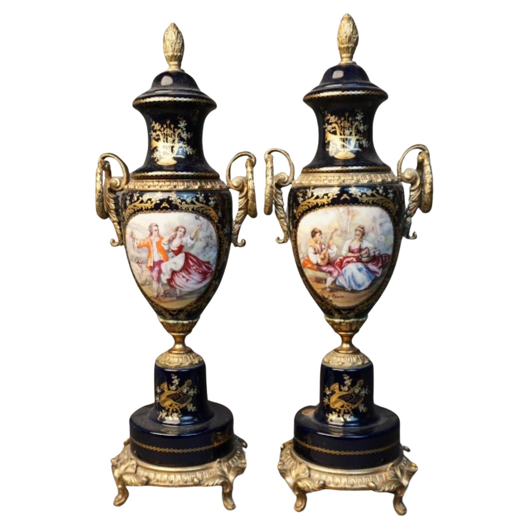 A Pair of  French Empire Sèvres Porcelain Gilt Bronze and Transfer Covered Urns For Sale