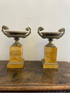 A Pair of French Empire Style Gilt bronze Urns on Marble Stands, 20th Century