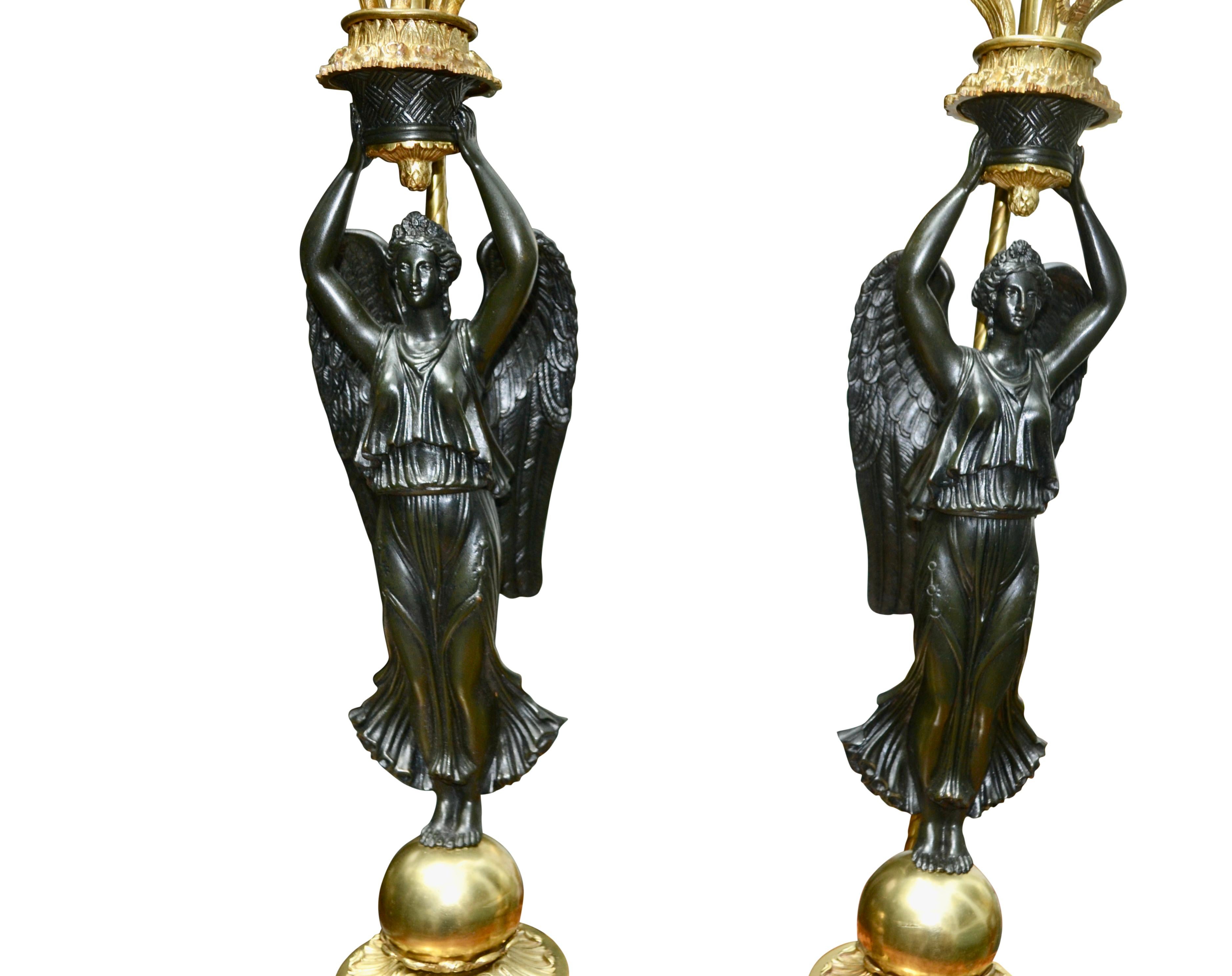 A Pair of French Empire Style Patinated and Gilt Bronze Winged Victory Lamps For Sale 8