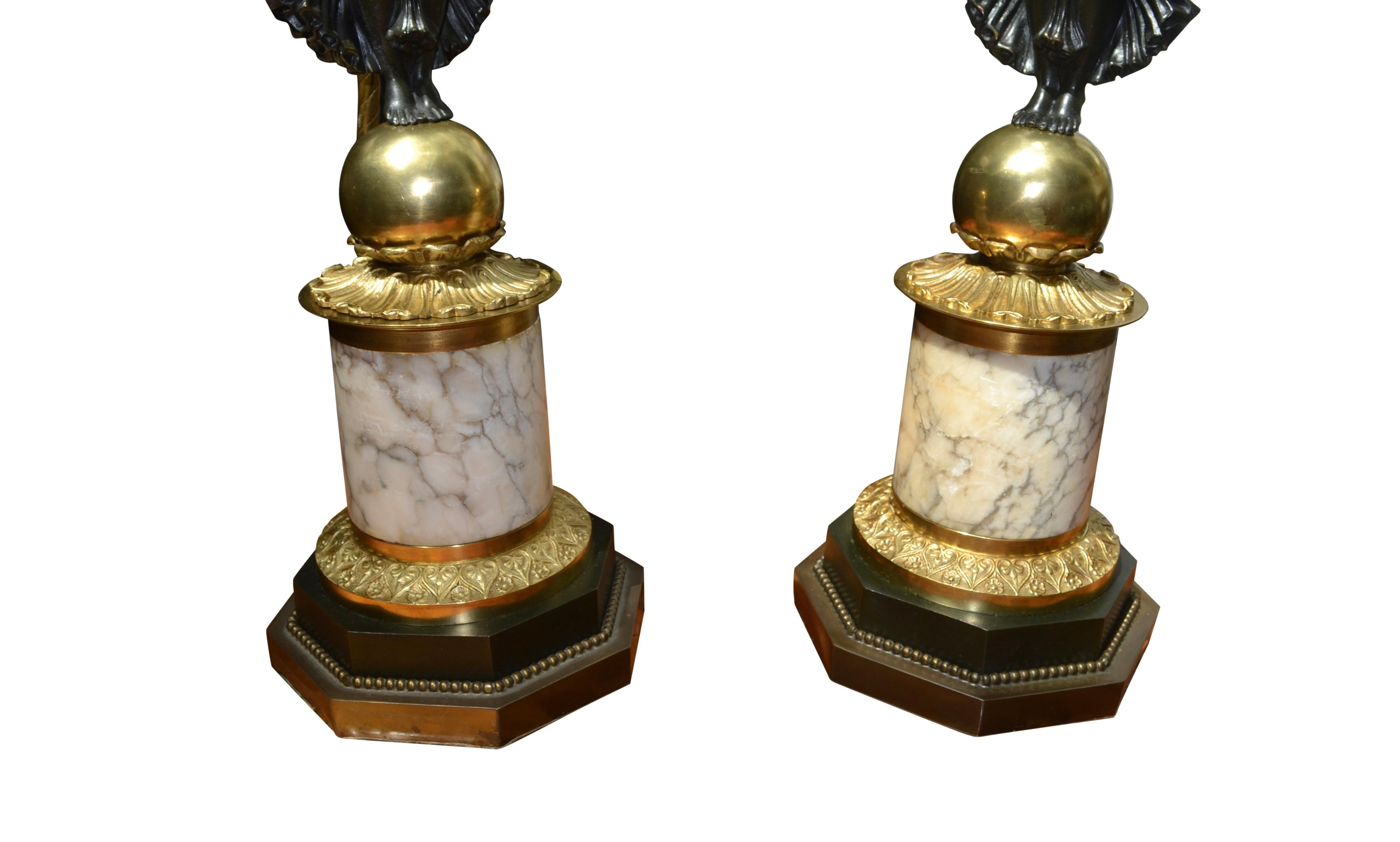 A Pair of French Empire Style Patinated and Gilt Bronze Winged Victory Lamps For Sale 11