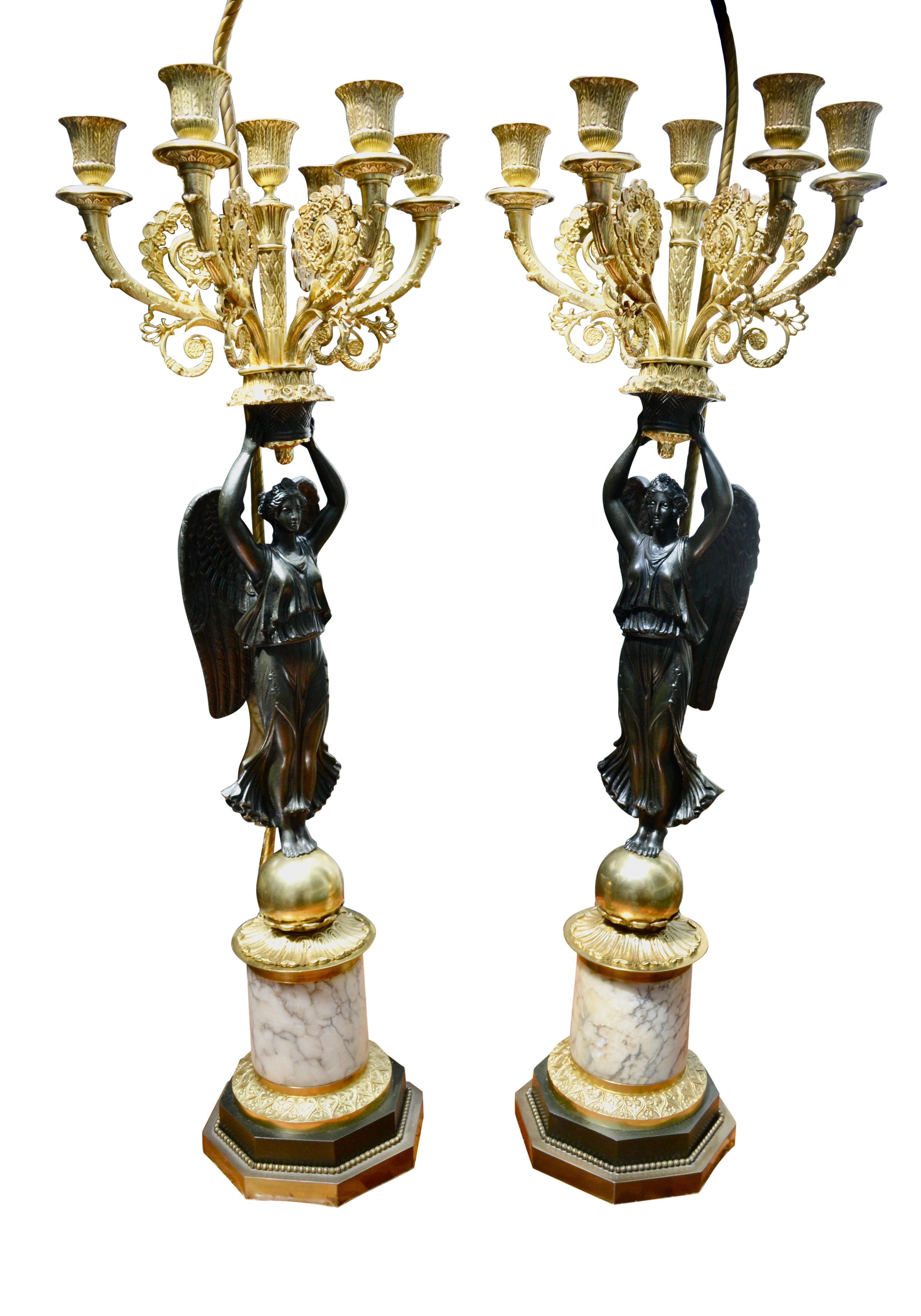 19th Century A Pair of French Empire Style Patinated and Gilt Bronze Winged Victory Lamps For Sale