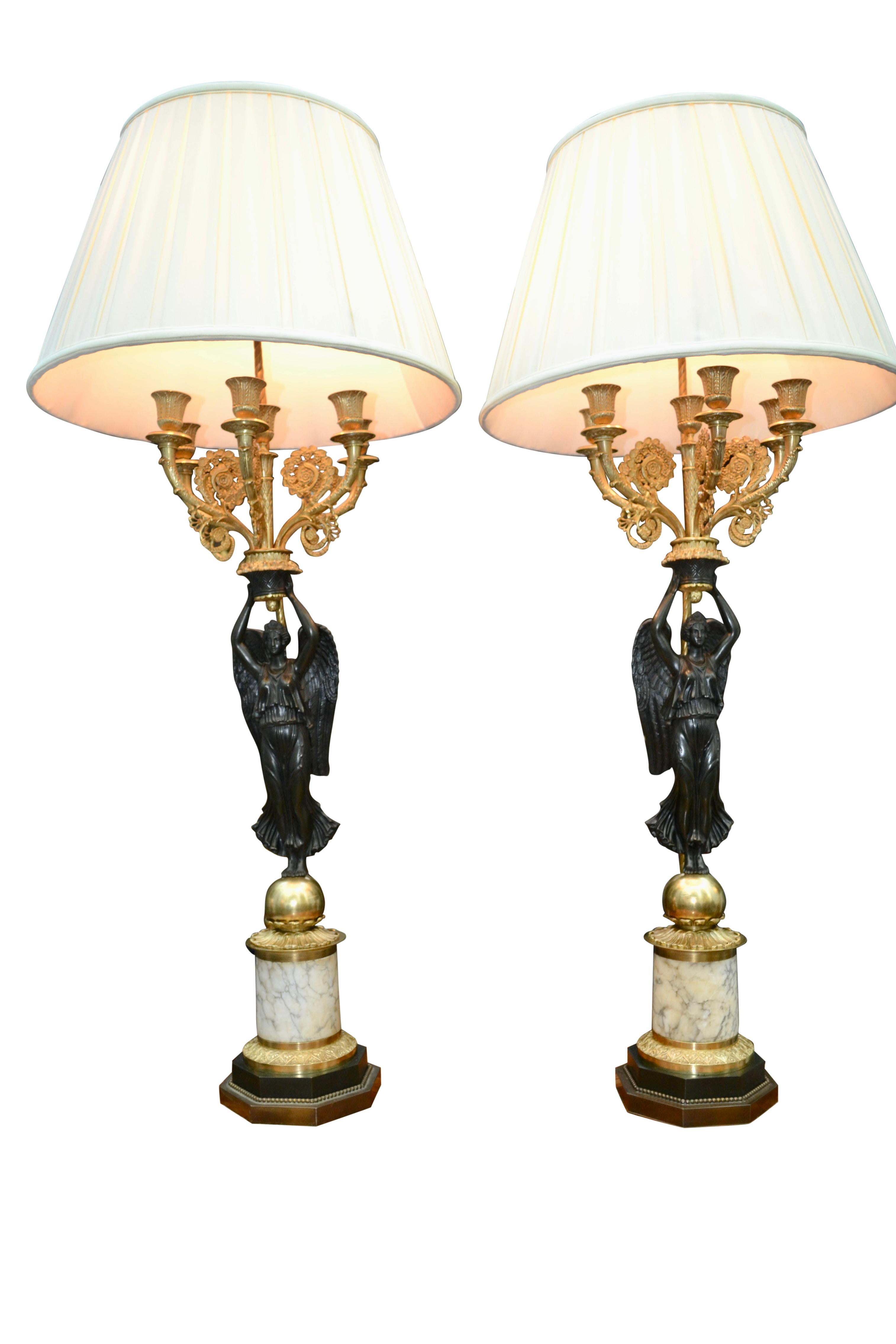 A Pair of French Empire Style Patinated and Gilt Bronze Winged Victory Lamps For Sale 1