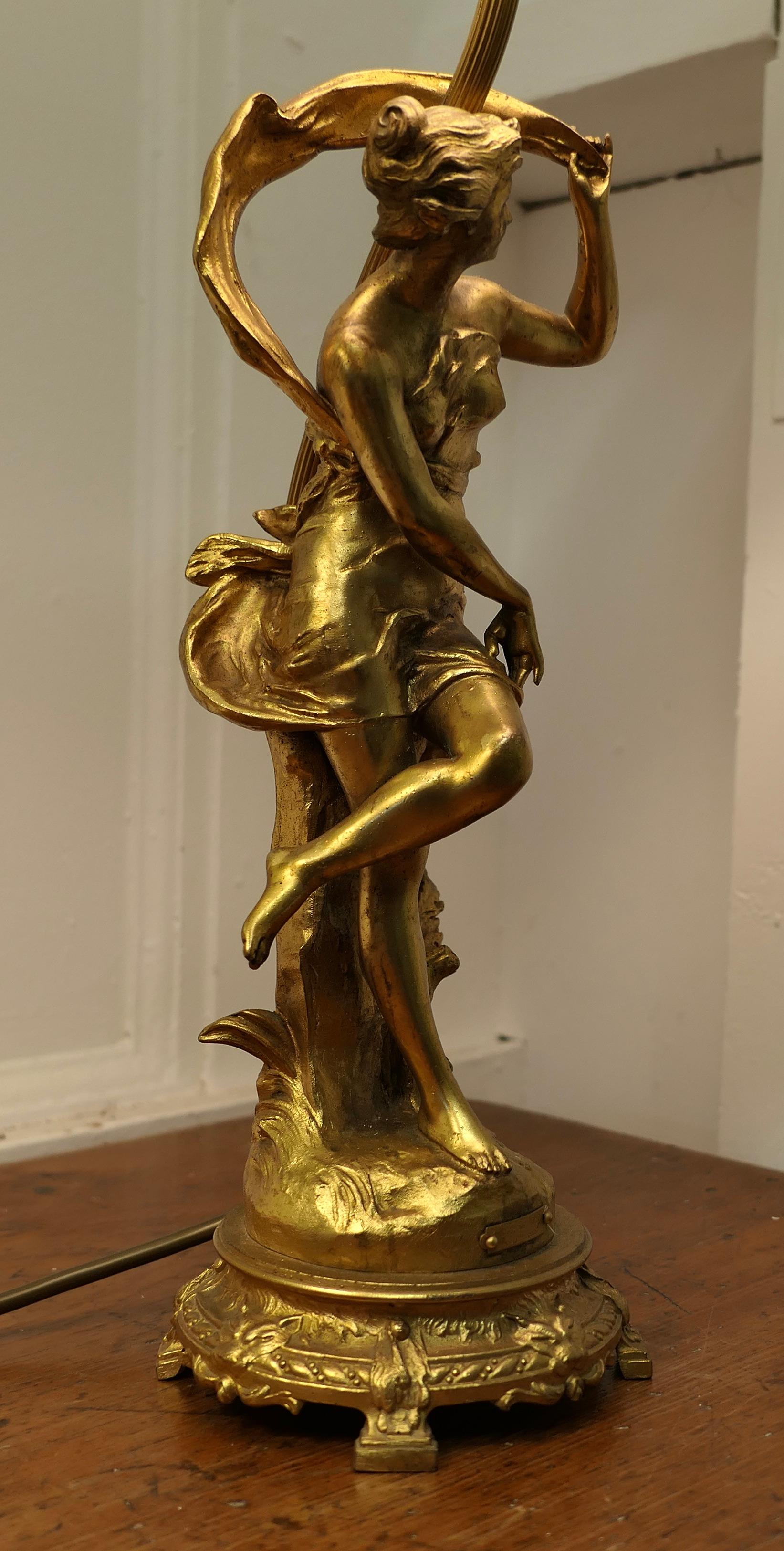A Pair of French Figural Brass Lamps, after Ernest Justin Ferrand

A Pair of French Figural Brass Lamps, Coup de Soleil and Coup de Vent by Ferrand
 This charming pair dates from the 1900s, each figure has a gilt patina and an identifying plaque and