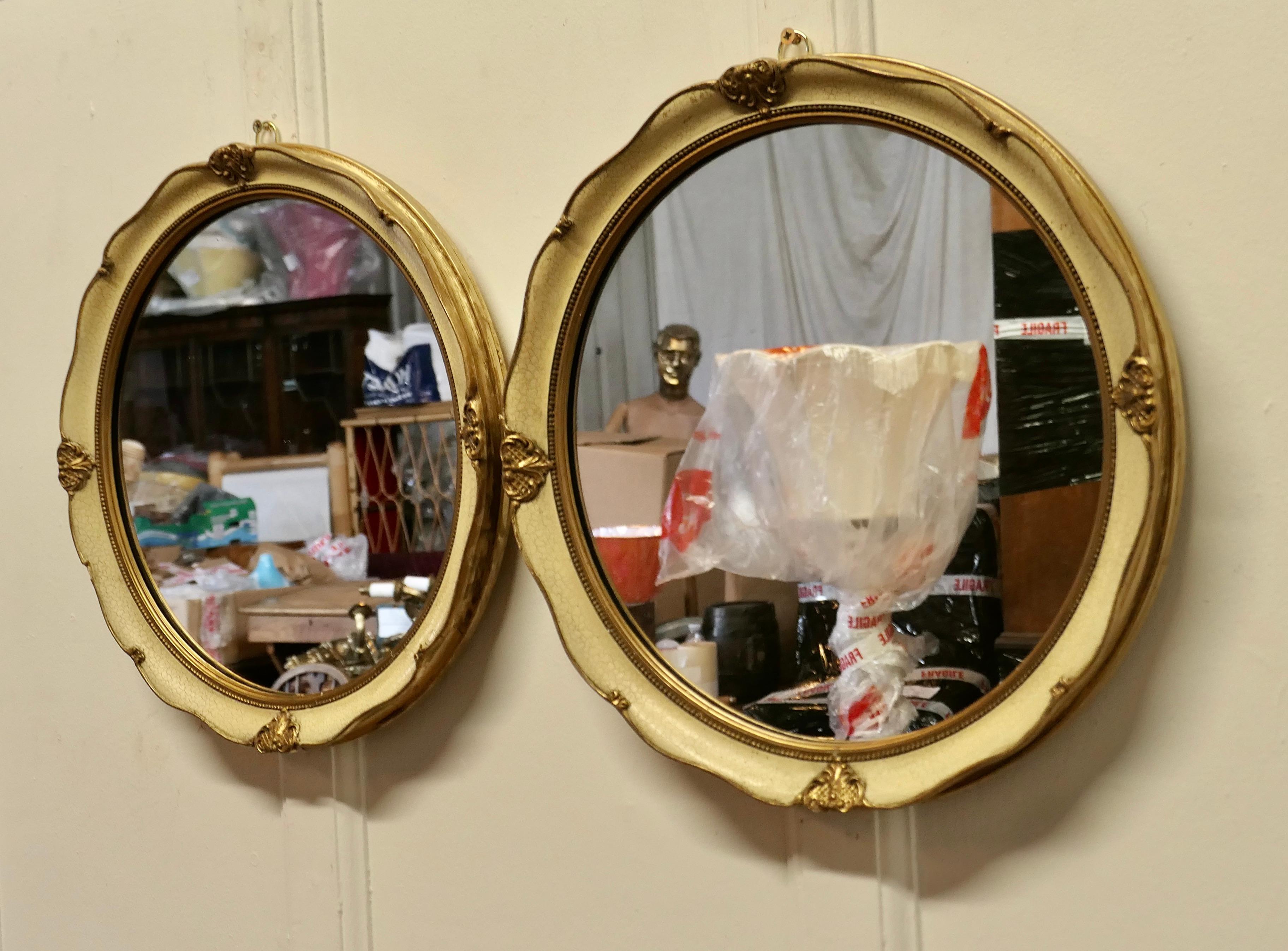 Early 20th Century A Pair of French Gilt and Cream Crackle Finish Wall Mirrors   For Sale